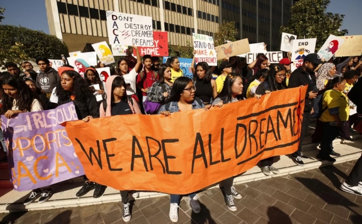 Students rally in downtown Los Angeles in support of the Deferred Action for Childhood Arrivals program, which allows certain young people without legal status to receive work permits, at a 2019 demonstration.(Al Seib / Los Angeles Times)